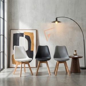 Modern dining chairs in a living room setting with industrial lamp and abstract art.
